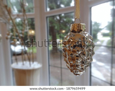 A small golden Christmas bauble 