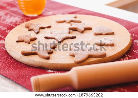 Christmas homemade gingerbread cookies on cutting board