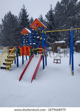 
Children's playground in the winter city park