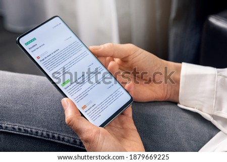 woman using phone to read customer reviews about service and product quality before online shopping Royalty-Free Stock Photo #1879669225