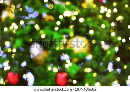 Christmas bokeh - Christmas tree in lights. Christmas tree bokeh light abstract holiday background. defocused bokeh lights.