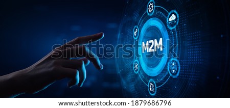 M2M Machine-to-machine technology concept. Hand Pressing button on virtual screen. Royalty-Free Stock Photo #1879686796