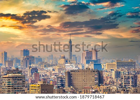 Modern buildings and TV Tower of Cairo at sunset