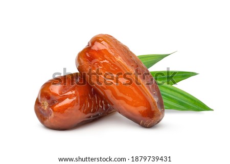 Dried Date palm fruits with green leaf isolate on white background. Royalty-Free Stock Photo #1879739431