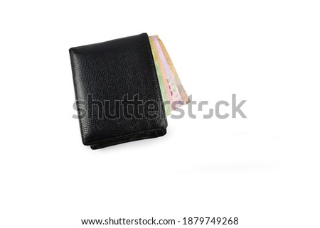 Top view of New black genuine leather wallet with banknotes and credit card inside isolated on white background(Focus selection).