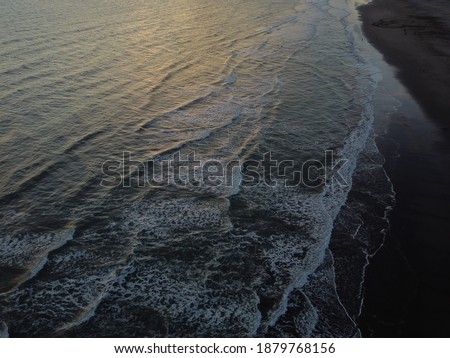 ine coasts, brown sand and waves, picture with a drone