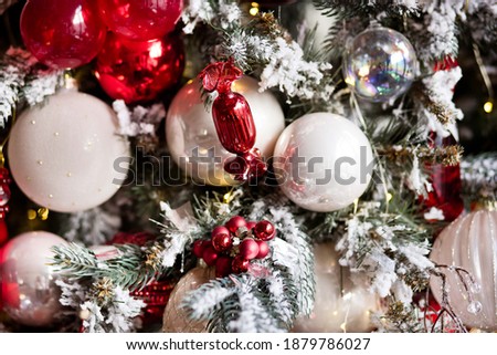 Balls on christmas tree. Bokeh garlands in the background. New Year concept.