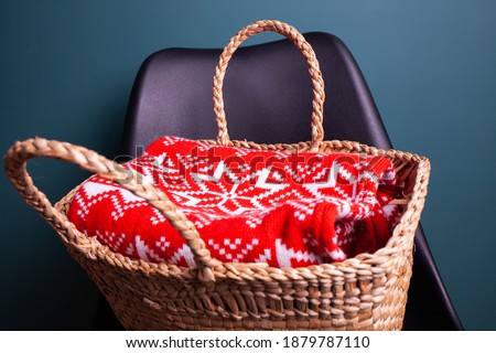 armchair with Christmas basket and sweater, gifts, holiday, New Year similar