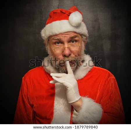 Father Christmas, Santa  finger on mouth to say shh
