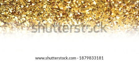 Gold (bronze) glitter shine dots confetti. Abstract light blur blink sparkle defocus horizontal long backgound.