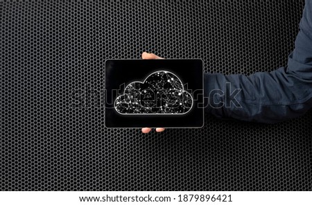 hand holding a mobile device with cloud storage, global communication online database