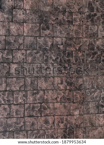 The walls are decorated with small gray square tiles.