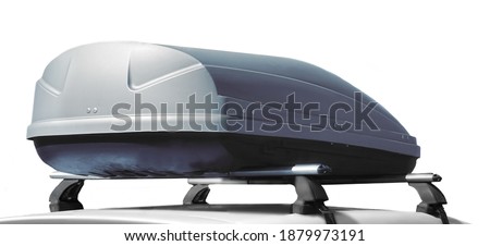 Caravan Car With Trunk Box Isolated On White Background. SUV Car Roof With Luggage Box On Rooftop On The Rack System Isolated. Closeup Of Roadster Car Roof Box And Rack System On Rooftop. Royalty-Free Stock Photo #1879973191