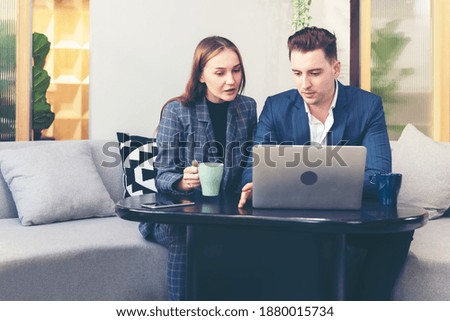 Business young people partner woman and businessman present and start up new project to success together outdoor modern nature office.  Woman and man drinking coffee and discuss business. 