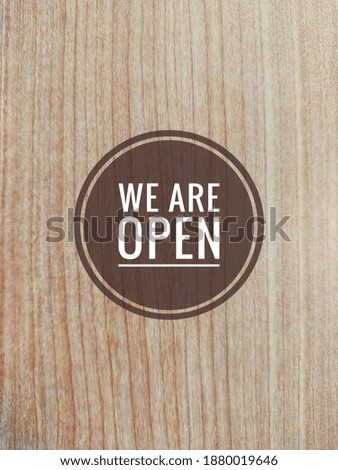 We Are Open on wooden wall