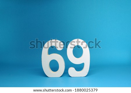 69 ( Sixty nine ) Isolated blue Background with Copy Space - Number 69% Percentage or Promotion - Discount or anniversary concept 