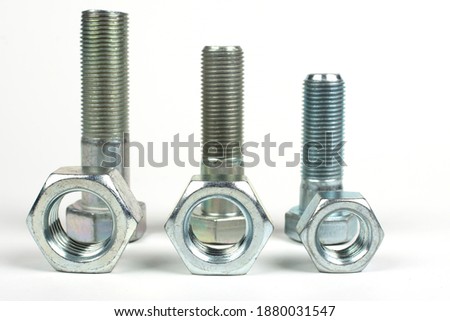 metal bolts of different sizes on a white background