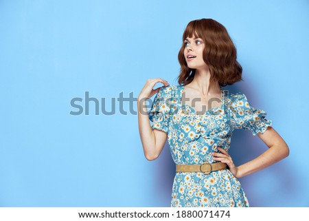 Woman portrait Look to the side of the hand on the shoulder stylish clothes 