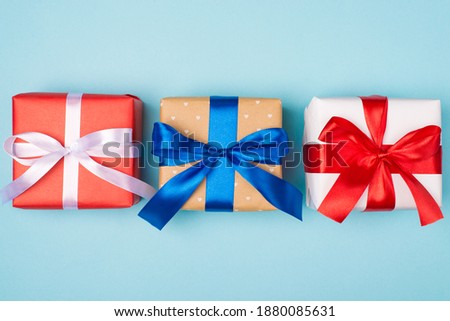 Happy holidays concept. Banner photo image close up view of three beautiful present boxes for whole family wrapped in different paper isolated pastel tone color background with empty blank space