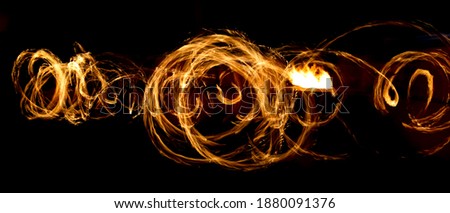 Flame of fire in motion at night. Abstract background