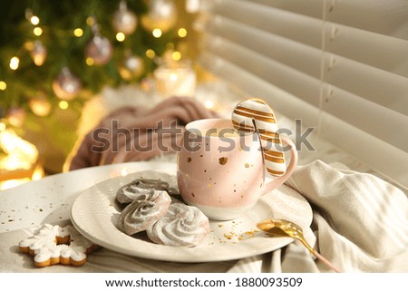 Composition with cup of hot drink on windowsill