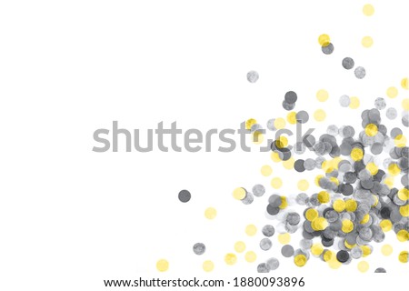 Bright yellow anf gray confetti isolated on a white background. Top view. Copy space.