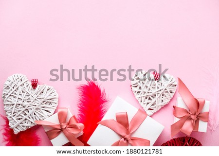 Happy valentine's day greeting card mockup. Gift boxes and hearts. Copy space. Red and white feathers. Top view. Flat lay