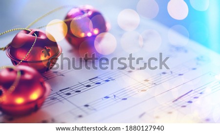 Christmas Sheet Music. Christmas decorations on music sheets, closeup

