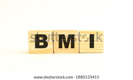 The word BMI. Wooden cubes with letters isolated on white background.