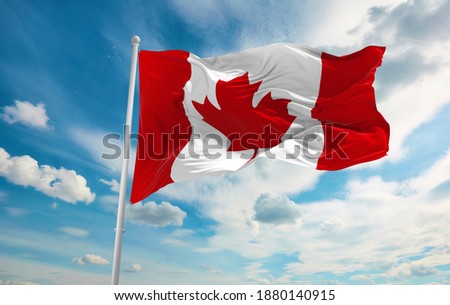 Large canadian flag waving in the wind