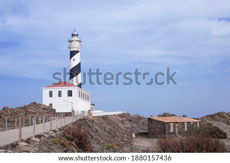 lighthouse on the edge of a cliff protecting the ships of the Mediterranean sea