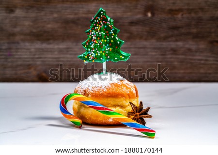 christmas tree lollipop and doughnuts with sugar powder (jewish holiday Hanukkah)
