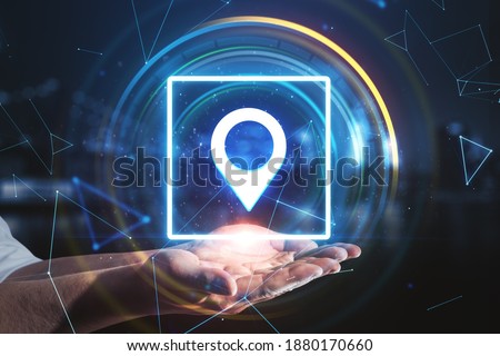 Hand holding glowing digital geolocation gps interface. Geolocation and distributed data concept