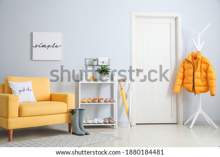 Stylish interior of modern hall with shoes on stand Royalty-Free Stock Photo #1880184481