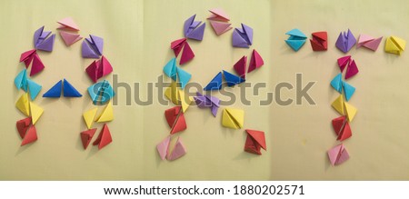 type art in  different color of origami 3d triangle pieces of papers .wallpaers