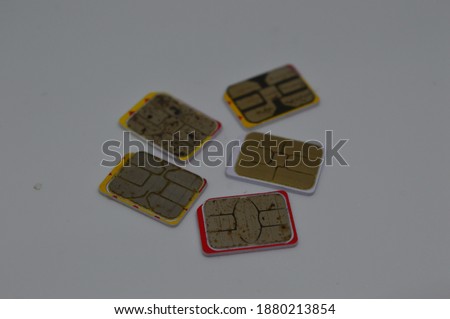 many of used nano sim card that was dirty, and have rust on it on white background for telecommunication