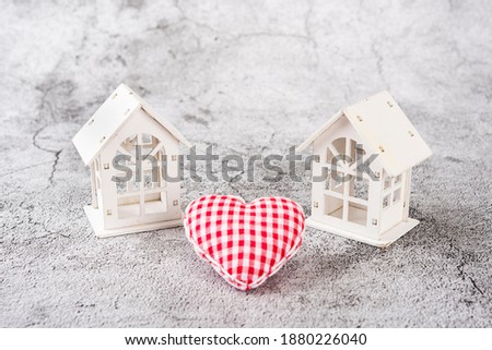 White house miniature and heart-shaped mini cushion close up