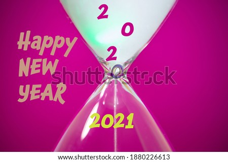 Hourglass on a pink background, Corona, New Year