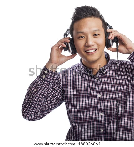 Handsome young asian man listening to music