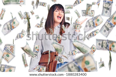 Young plus size woman wearing leather bag celebrating victory with happy smile and winner expression with raised hands