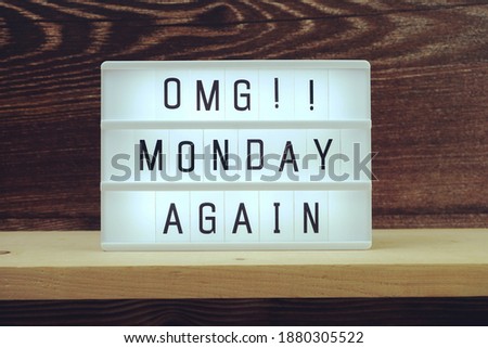 Monday Again word in light box on wooden background
