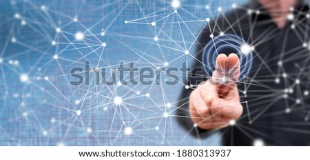 Man touching a network on a touch screen with his fingers