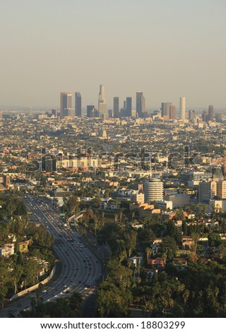 Los Angeles skyline and freeway at sunset