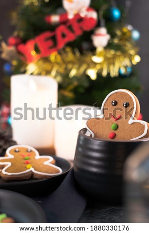 Gingerbread snowman and  Christmas tree and festive decoration set for new normal Christmas and 2021 New Year celebration. Gingerbread or Gingerbread cookies is a gift for Christmas greeting.  
