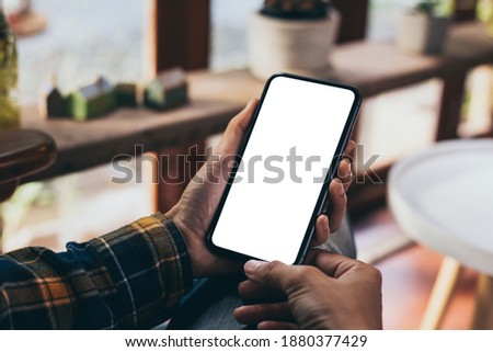 cell phone blank white screen mockup.woman hand holding texting using mobile on desk at office.background empty space for advertise.work people contact marketing business,technology