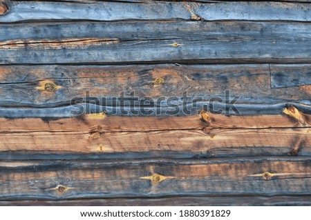 Wooden pattern, an aged  log wood building Royalty-Free Stock Photo #1880391829