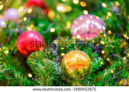 Colorful christmas ball on the branches fir and green background, Soft.