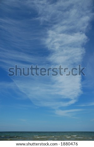 Fleecy clouds over the sea