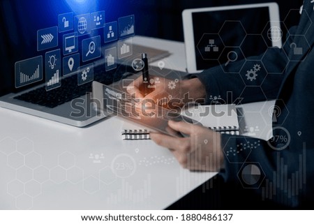 Double exposure of financial graph. Stock market chart. Businessman hand working on tablet with laptop and business technology marketing concept, Blurred background.