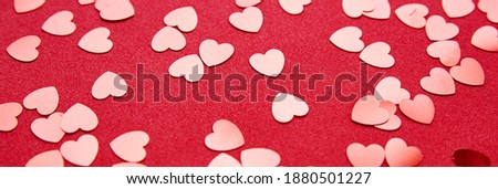 Valentine's Day background. Hearts on the red background. Valentine day concept. Top view, flat lay